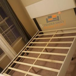 Brand new king size white faux leather platform bed frame. 