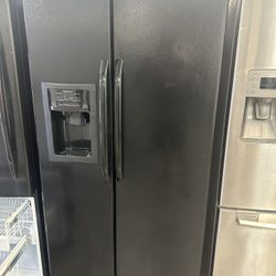 Side By Side Black GE Refrigerator 
