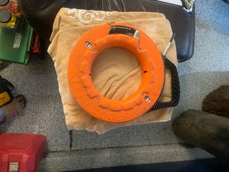 Klein Tools fish tape, model 56335, featuring a 25-foot flat steel tape [5.2, 5.9].