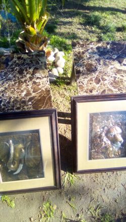 Living room table with two end tables and two pictures