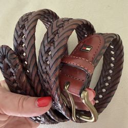 Tommy Hilfiger men's braided leather belt featuring a brass buckle and signature logo plaque