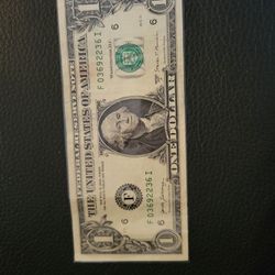 Dollar bill with low serial number poker