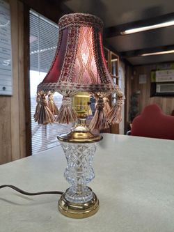  VERY UNIQUE LOOKING VINTAGE SMALL TABLE LAMP  BRASS AND GLASS  GOOD CONDITION 13.5 INCHES TALL  THIS LAMP WORKS GREAT  REALLY NEAT LOOKING SHADE 