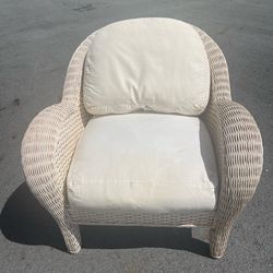 Rattan chair with cushions
