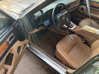 1989 Jaguar XJ6 has 144,000 and the original Rims go with it $4000