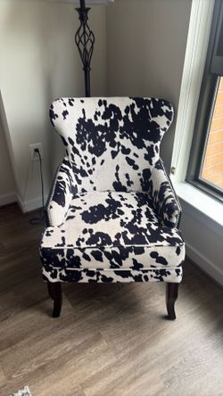 Black and white cow chair