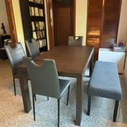 Wonderful dining set for sale with six chairs and a table that extends to seat eight.
