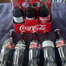 9 Vintage Coca-Cola Collector Bottles 