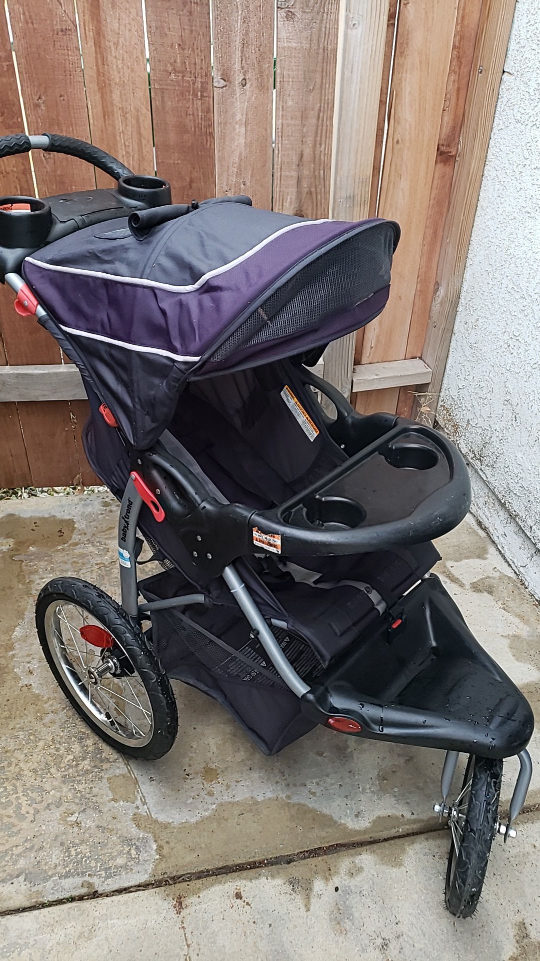 Purple/Black Baby Trend jogging stroller