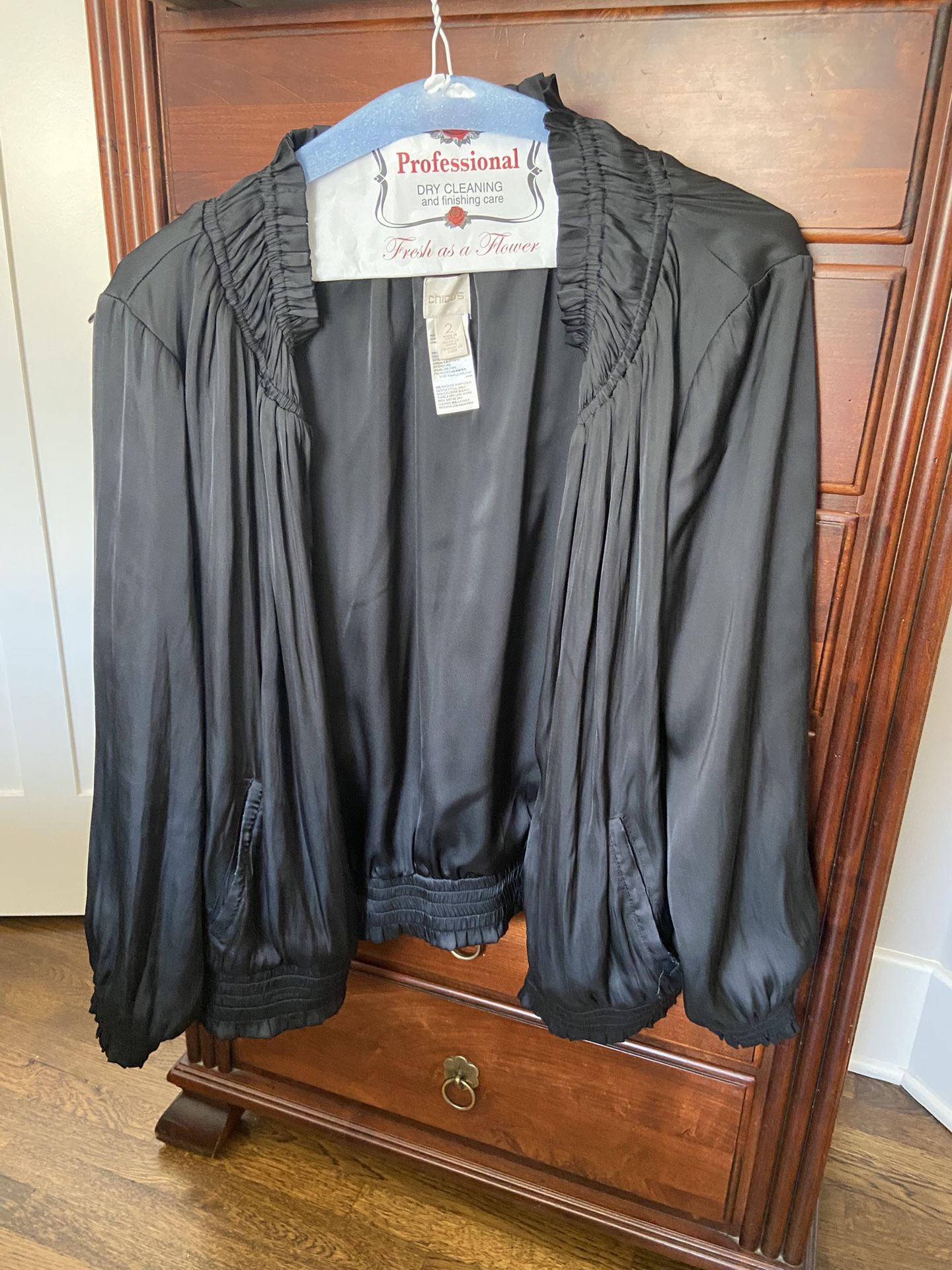 Chico's brand women's black jacket with a satin feel and dressy look.