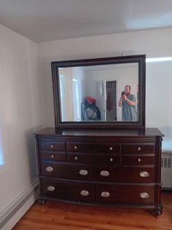 7-Drawer Dark Brown Dresser With A Matching Mirror
