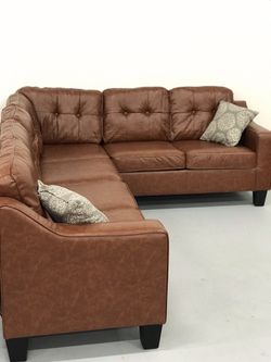 Promotional item - brand new sectional with ottoman- firm price