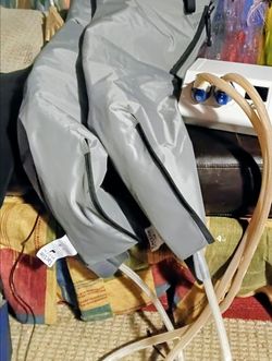 Tactile Medical Entre Plus pneumatic compressorof a Tactile Medical Entre Plus pneumatic compression system, featuring connected brown dual-hose garme