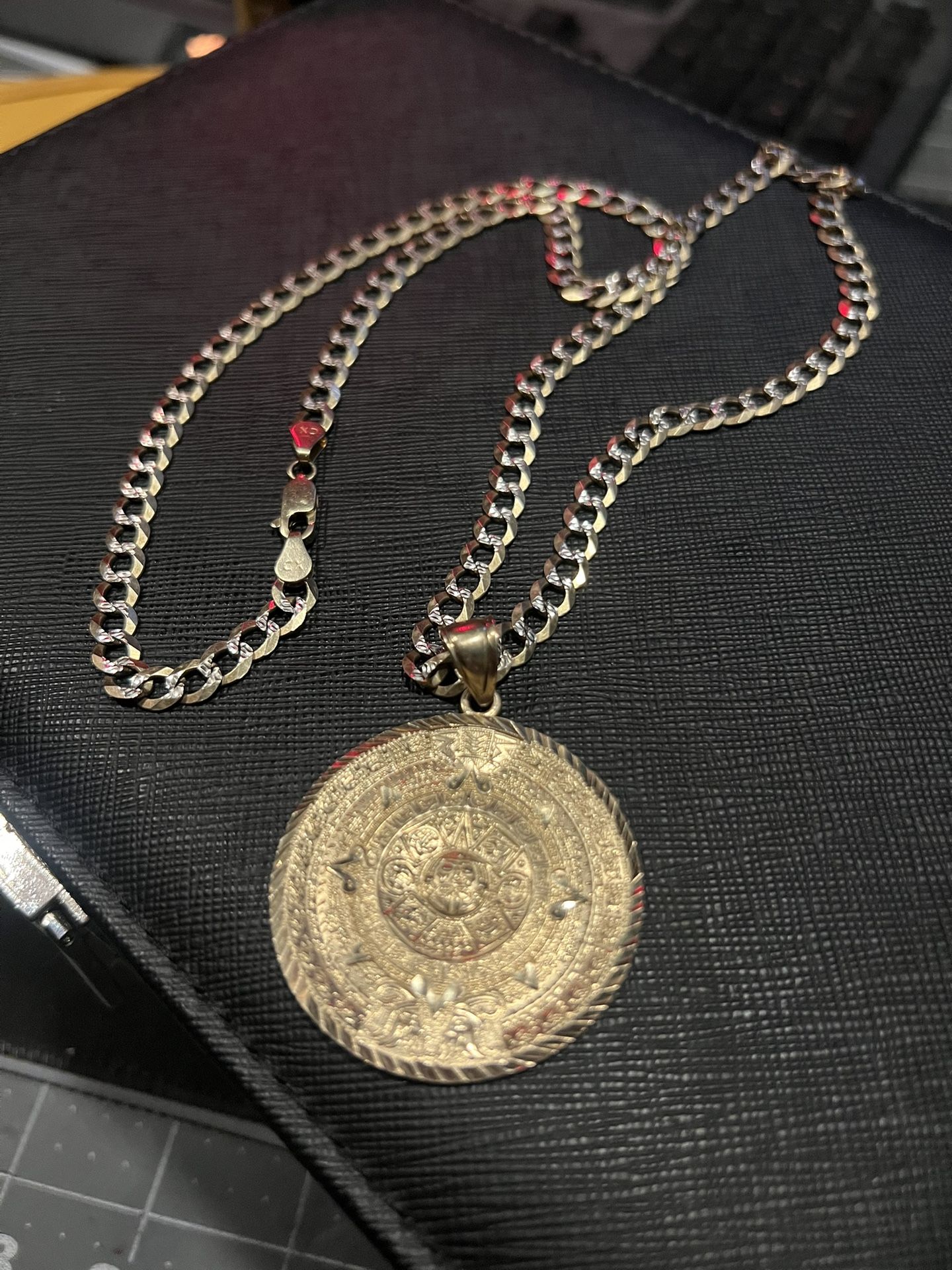 14 Kt curb chain & Aztec pendant