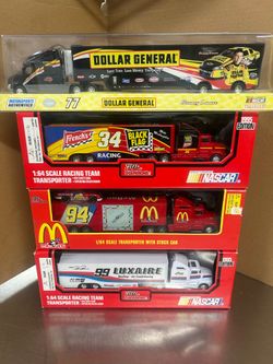 Lot of 4 new Racing Champions Nascar 1/64th Transporters