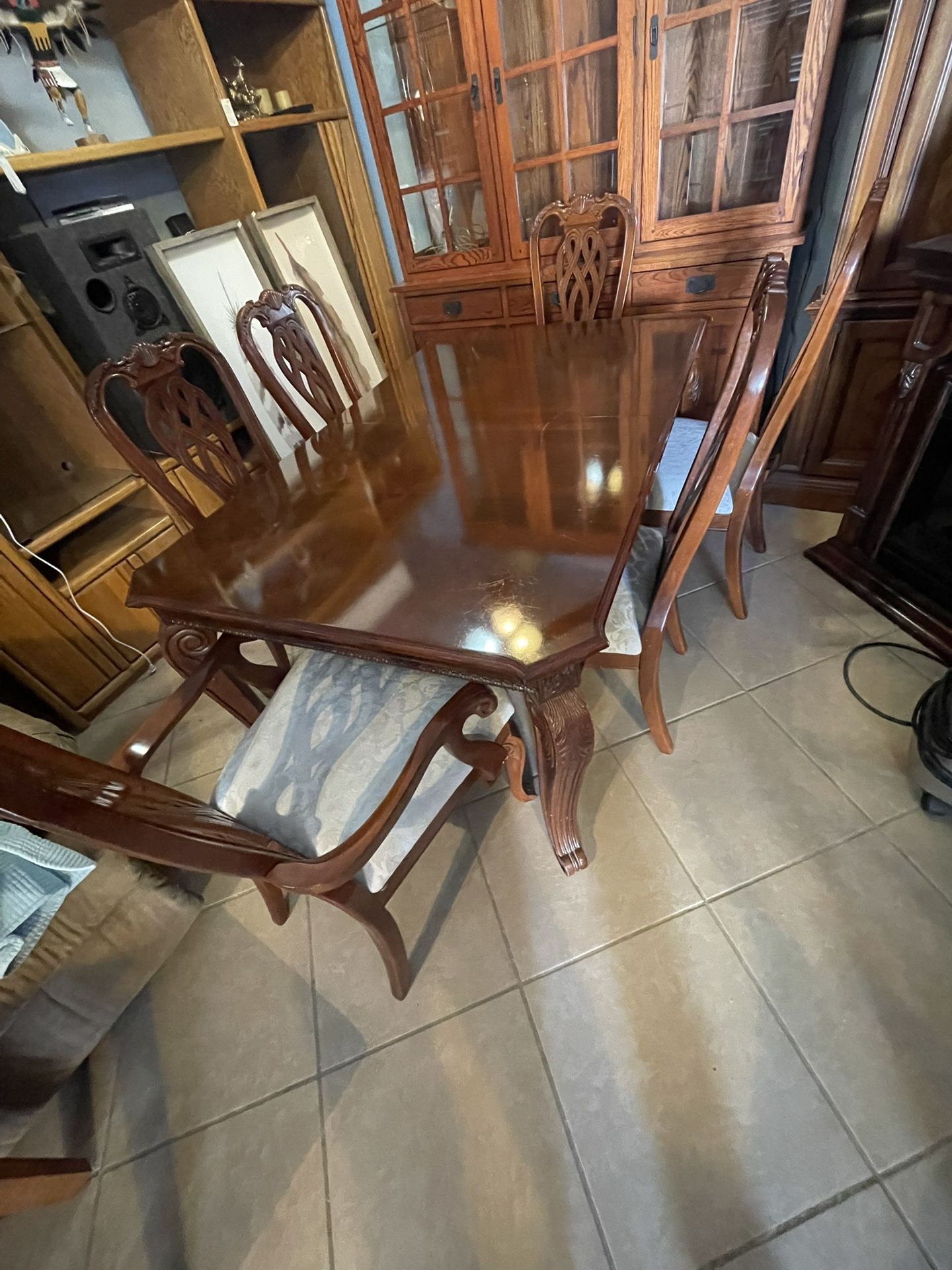 Wooden dining room, table, and chairs