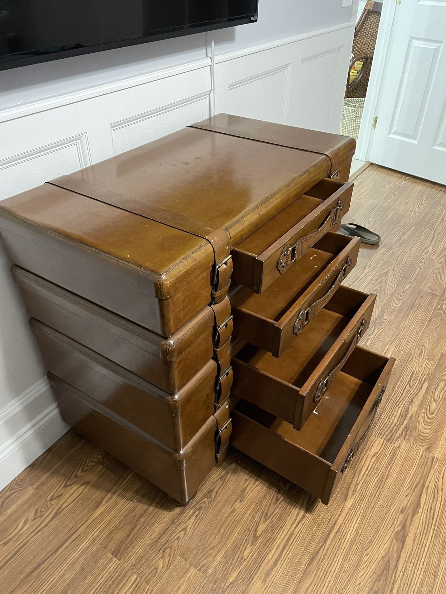 Custom chest of drawers in the shape of stacked suitcases