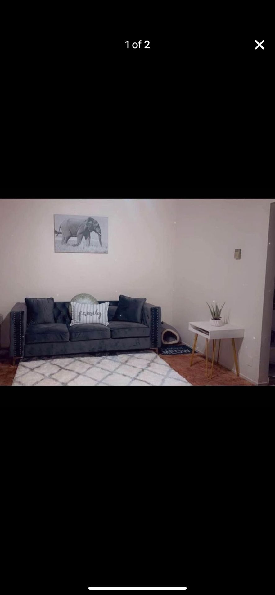 Grey tufted sofa