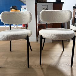 2 white dining chairs