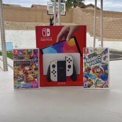 Nintendo Switch Oled with super Mario party and Mario kart deluxe 8 Floor Model 
