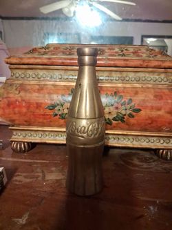 Solid brass coca cola bottle
