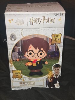 Gemmy Harry Potter Airblown Inflatable featuring Harry holding a small Jack-O'-Lantern.