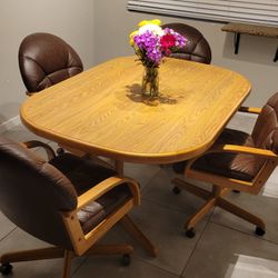3 Piece Table With 4 Rolling Leather Arm Chairs