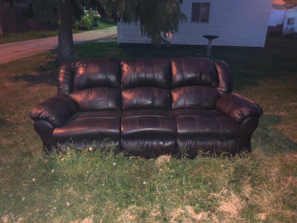 Brown leather sofa with recliners