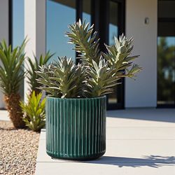 11.4-Inch Green Ribbed Planter, Drainage Ceramic planter in olive green with vertical ribbing, drainage hole, and a 11.4-inch width for indoor outdoor