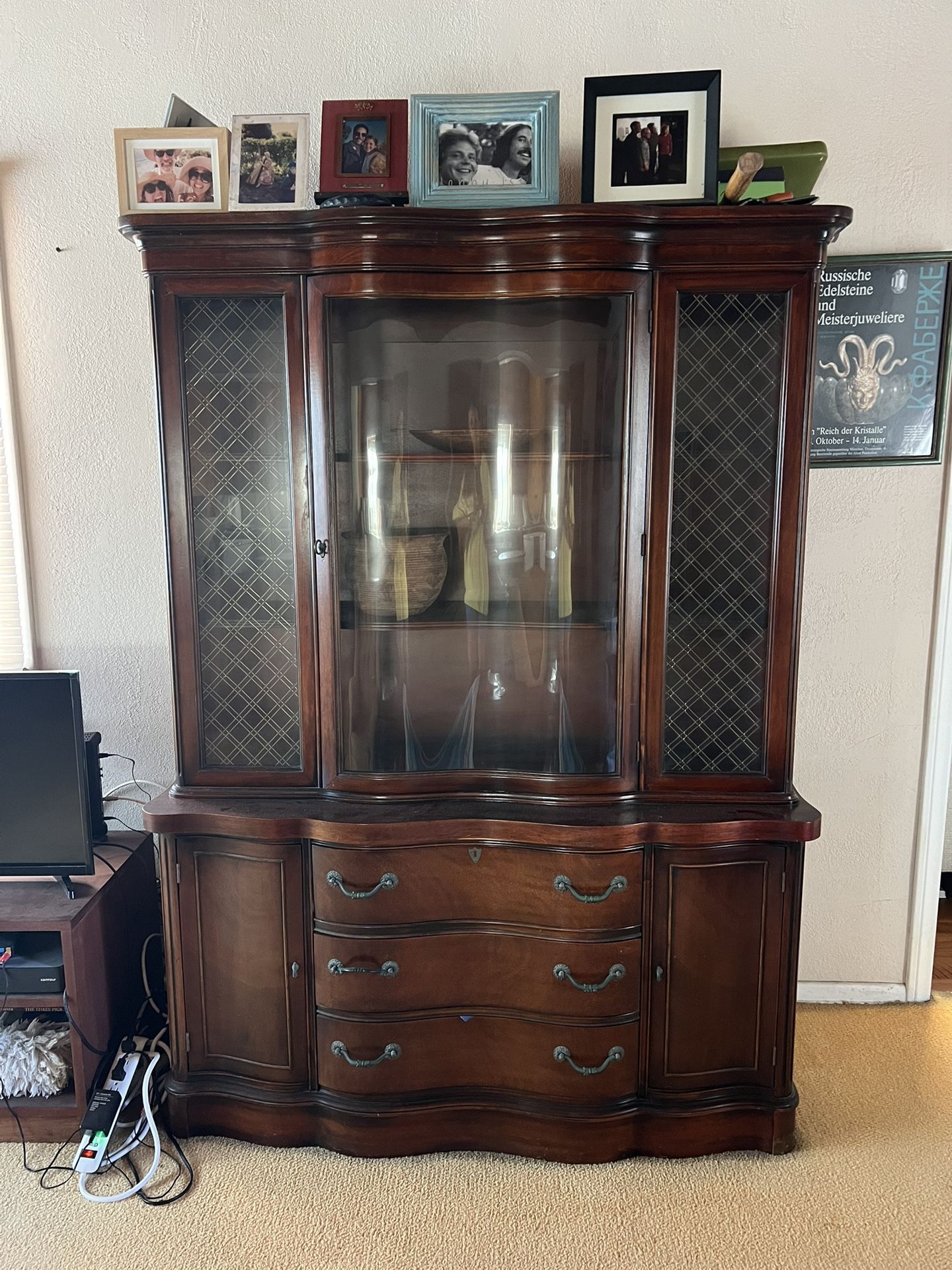 This is a mahogany federal-style china cabinet