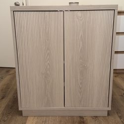 Wooden storage cabinet with shelves. 