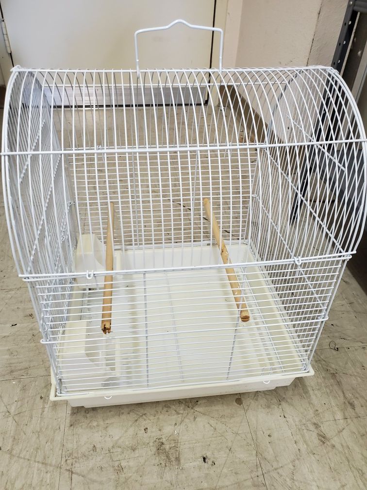 Bird cage with its water and food dispensers