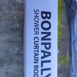 Two brand new curtain rod sets Brass and silver coated