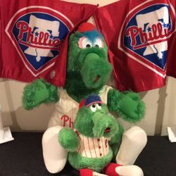 Phillies phanatic plush dolls and two car flags.