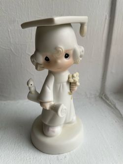 The 1980 Precious Moments figurine "The Lord Bless You and Keep You" (Model E-4721)