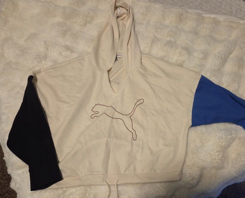 This is a Puma Women's Modern Sport Hoodie in a color-blocked design featuring off-white, black, and blue panels.