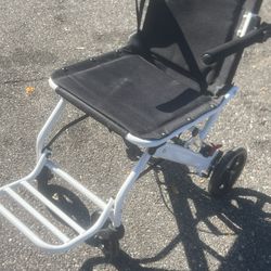 Small foldable transport wheel chair .  Great shape. Location below  31705 Wesley Chapel blvd Fl 33543 Storage Mart  