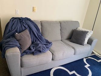 Gray couch with accent pillows