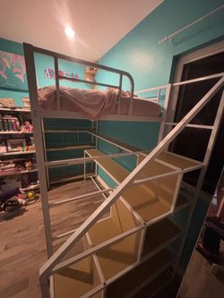 Twin lofted bed with steps/shelves/desk