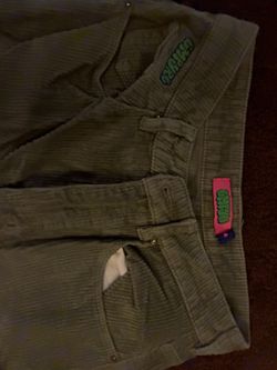 Olive green corduroy pants with a relaxed fit