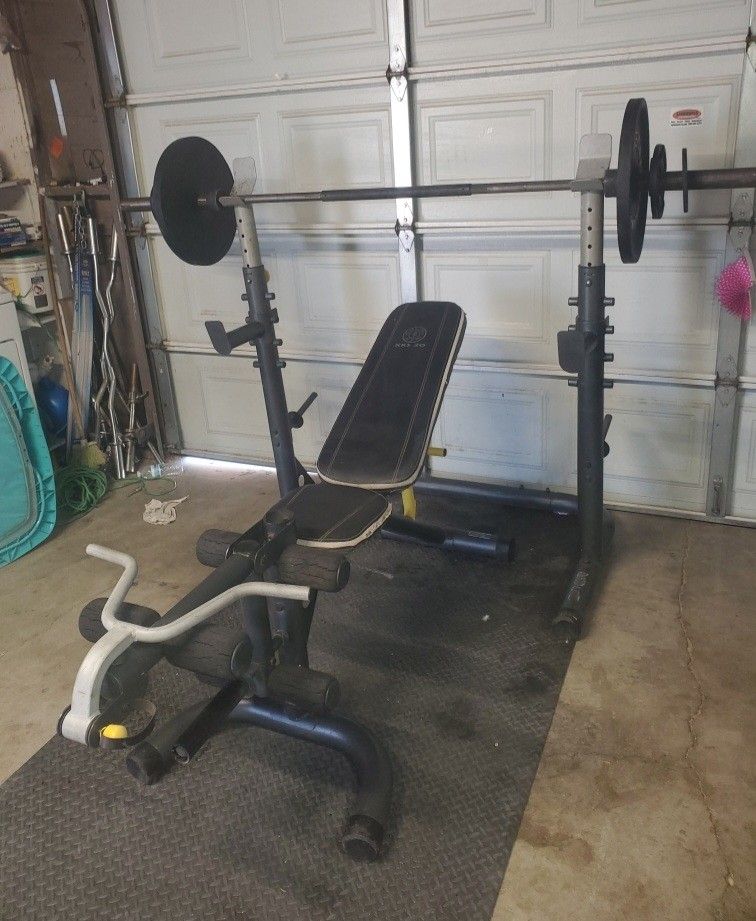 Olympic Weight Bench With Squat Rack Leg Developer curl bar & Olympic Weight set 140lbs read Descri