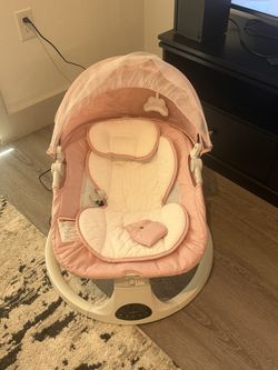Pink baby swing