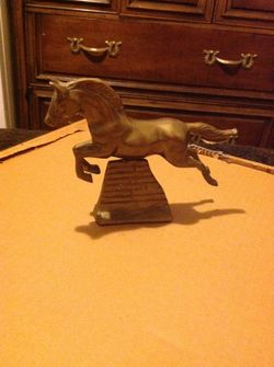 Vintage brass galloping horse on brass stand