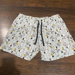 Peanuts Snoopy and Woodstock pajama shorts with blue and white stripes. 