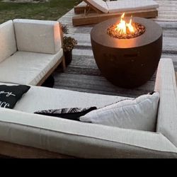 Outdoor sectional and chair with cushions