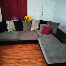 Black And Grey  Sectional Couch With Moving Barrel chair