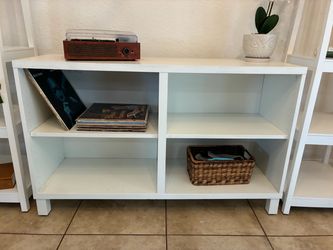White wood entertainment center with shelves
