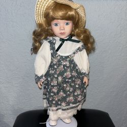 Porcelain doll with stand $25