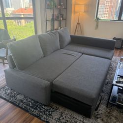 IKEA 3 seat sleeper sectional couch/bed with storage perfect condition open to offers