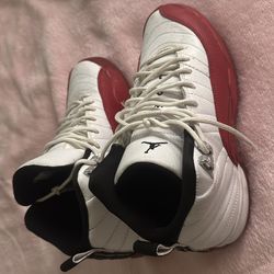 Jordan cherry 12s size 7women 5.5 men